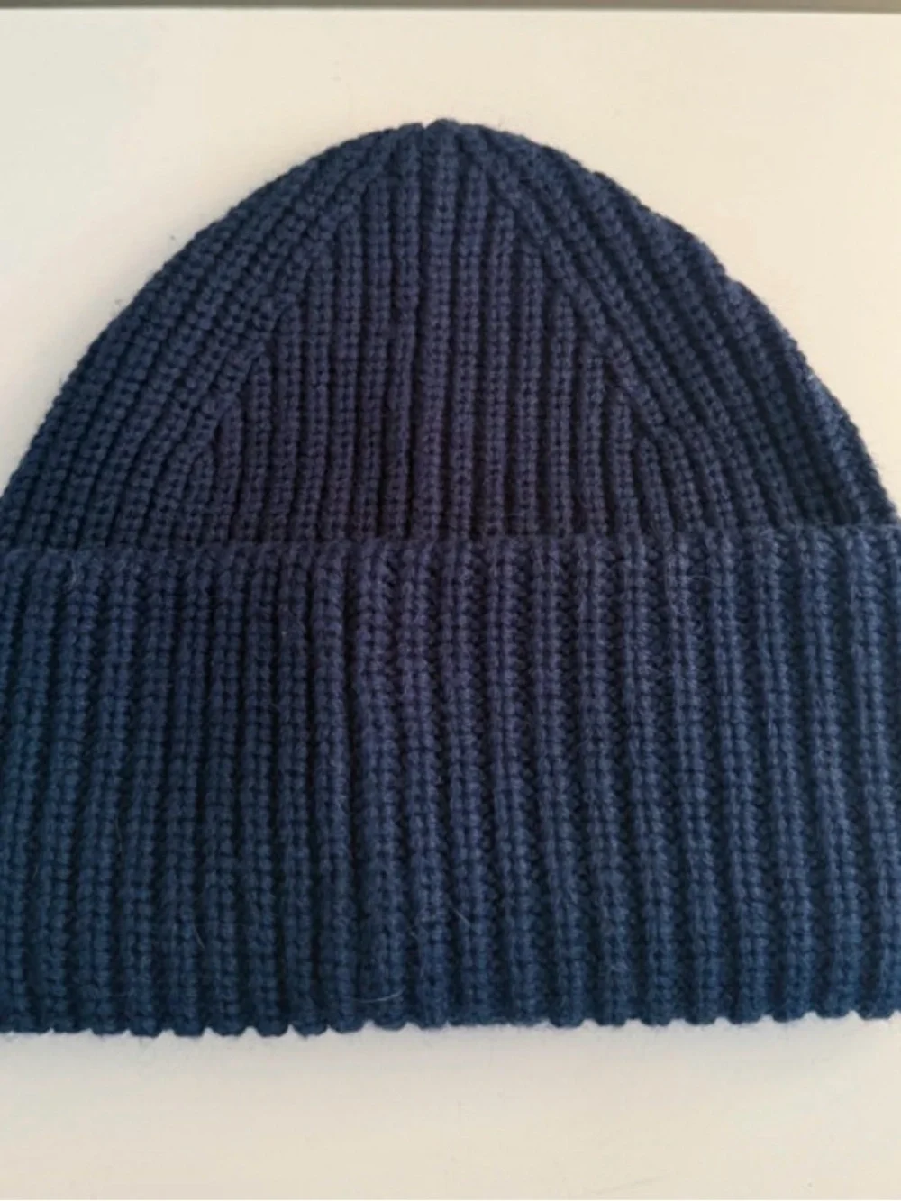 Coach Navy Blue patch beanie features a rib-knit design and a tonal rubber logo